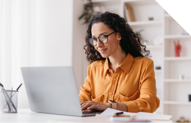 An Isograd employee working remotely from a laptop
